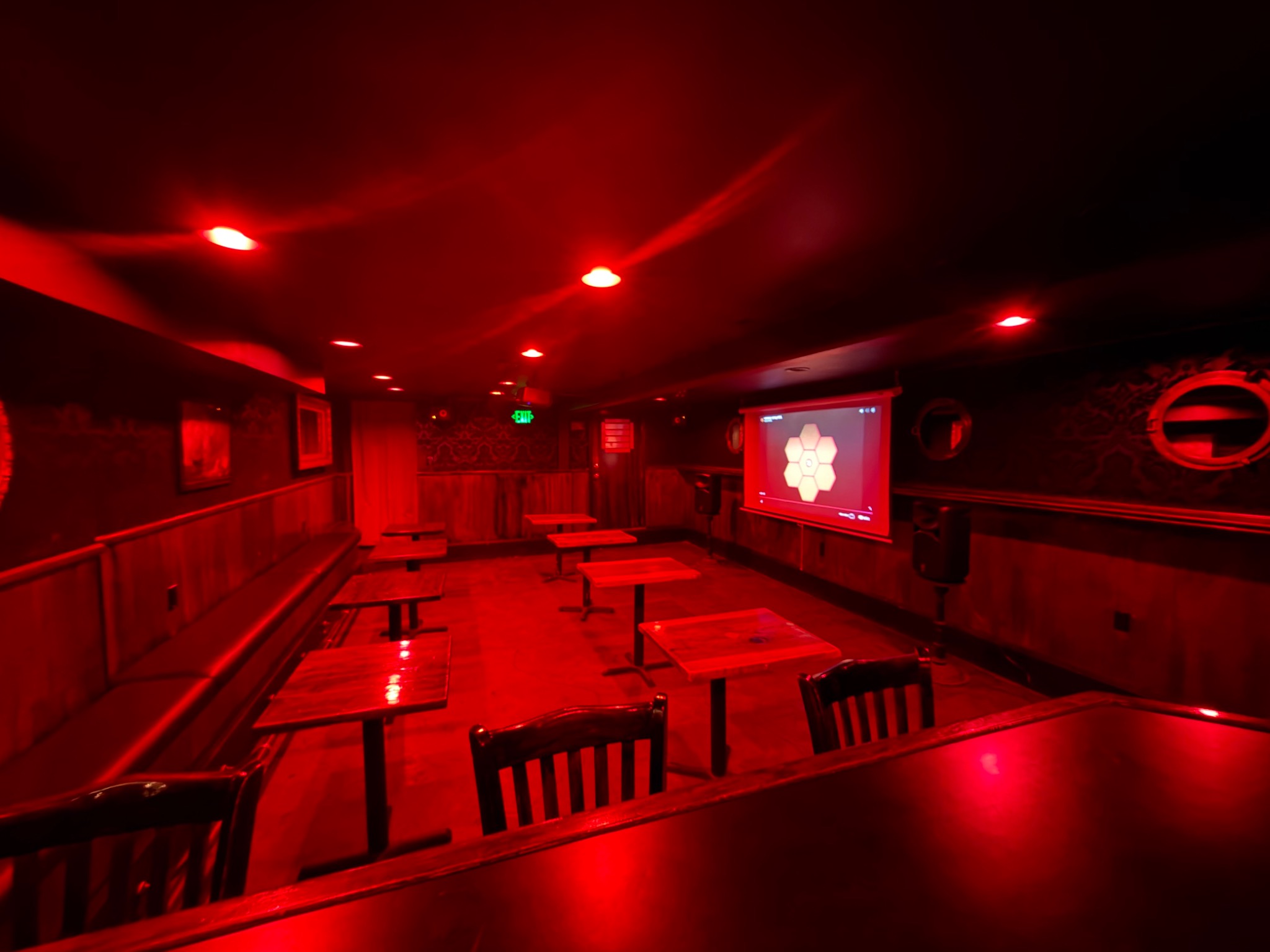 screen and seating in the basement room